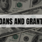 Rectangle containing the text Loans and Grants with an image of cash in the background.