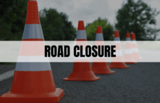 Text saying Road Closure with orange traffic cones in the background.