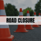 Text saying Road Closure with orange traffic cones in the background.