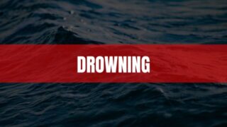 Text that says Drowning on a red rectangle with water in the background