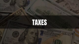 Text that says Taxes on a black rectangle with an image of money in the background