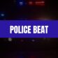 Text that says Police Beat on a blue rectangle with a police car with lights on in the background