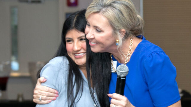 First-Generation student Stephanie Martinez hugs Jennifer Herring, associate director of Student Impact Initiatives, at the celebration marking five years of First-Gen initiatives at UNG. Martinez shared her story at the event. (UNG photo)