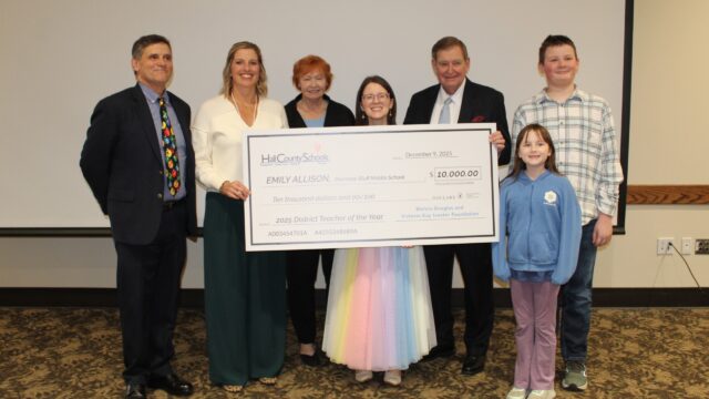 Emily Allison (center) with L-R Hall Co. Schools Supt. Will Schofield, 
Cherokee Bluff principal Leigh Wilson, the Ivesters and family. (Hall County School District picture)
