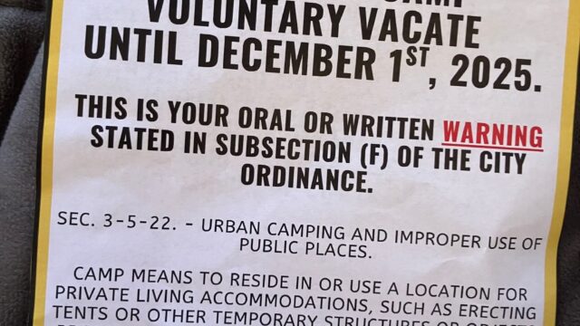 Eviction notice city officials posted at the Flat Creek homeless camp last month. (City of Gainesville photo)