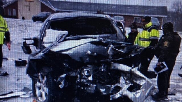 Investigators with Buford couple's pickup. (Madison Co. Sheriff's Dept. photo courtesy WISH-TV)