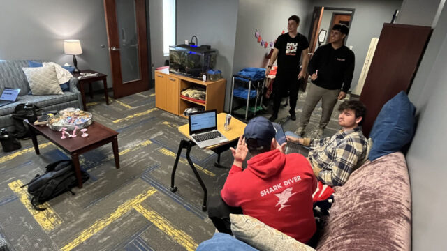 Student veterans (back left to right) Ian Camp and Wilfred Alvarez engage in a game of indoor table darts while Bailey Amey and Jacob Smith converse in Dahlonega's dedicated Veterans Resource Lounge.
(UNG photo)