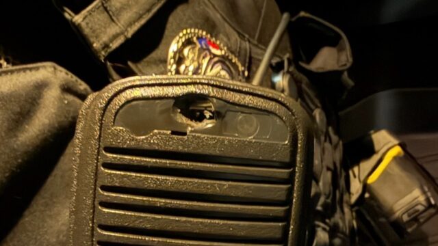 Gainesville Police Dept. photo shows radio microphone worn by wounded officer when he was shot early Friday morning.