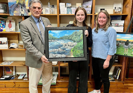 Rep. Clyde awards Second Place to Calli Carlisle’s (center) “Chattahoochee River: Horseshoe.”  (Photo courtesy Andrew Clyde)