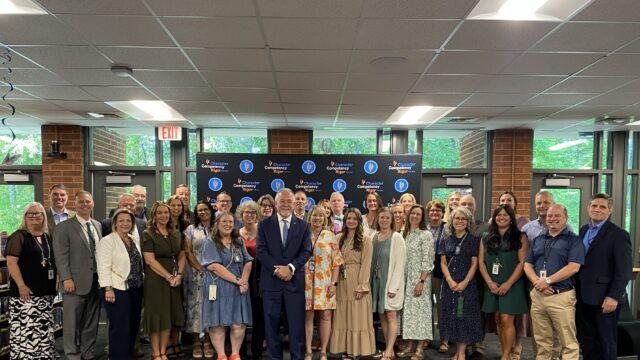 State Schools Supt. Richard Woods (front & center), Hall Co. Schools Supt. Will Schofield (front, far right) with officials from recognized schools. (HCSD photo)