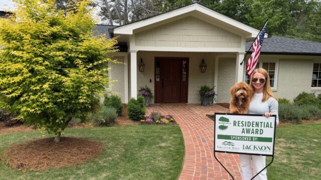 Katie Crumley and dog, Burtie, at home in Gainesville, recipient of the 2026 Residential Beautification Award. (GHCC PHOTO)