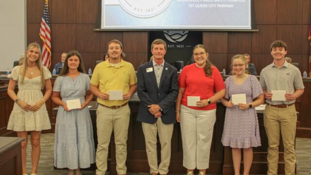 Recipients of the 2026 Gainesville Chicken Festival Scholarship are shown with Mayor Zack Thompson, center, during a formal presentation Tuesday night, May 19, before the Gainesville City Council. (City of Gainesville photo)