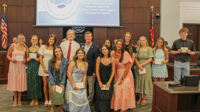 Scholarship winners with Mayor Zack Thompson at a recent City Council meeting.   

(City of Gainesville photo)