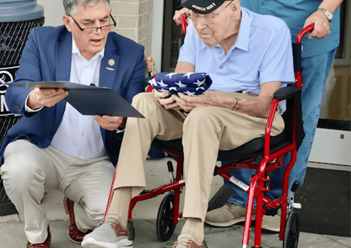 (Clyde presents Capt. Schubring with American Flag flown over U.S. Capitol (Patrick Fargason/Now Georgia via Clyde news release))