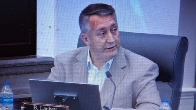 Gainesville City Manager Brian Lackey addresses the Gainesville City Council and Mayor Tuesday night.  (Screenshot from video of meeting)