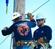 Two Jackson EMC linemen during competition. (Jackson EMC)