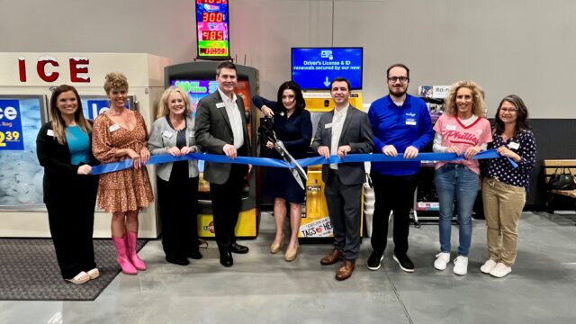 Hall County Tax Commissioner Darla Eden does the honors at ribbon cutting for new kiosk.  (Hall Co. Tax Commissioner Office photo) 